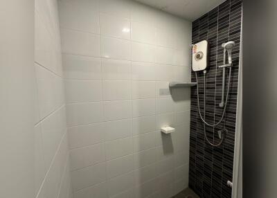 Modern shower area with electric water heater