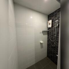 Modern shower area with electric water heater