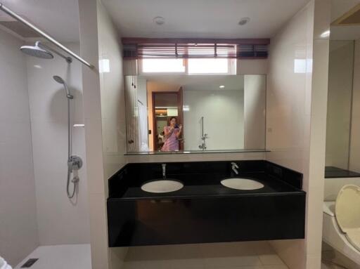 Modern bathroom with double sink and large mirror