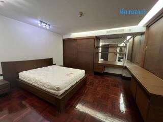 Master bedroom with wooden furniture