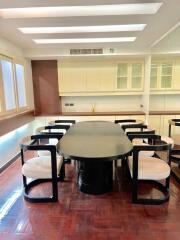 Modern dining area with glass table and stylish chairs