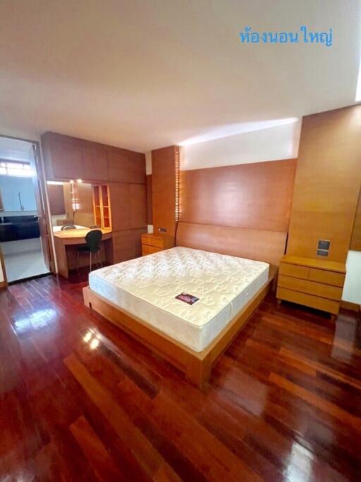 Spacious Bedroom with Wooden Floors