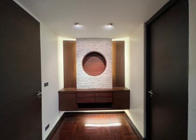 Modern hallway with accent wall and built-in console