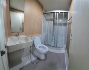 Modern bathroom with shower cabin and fixtures