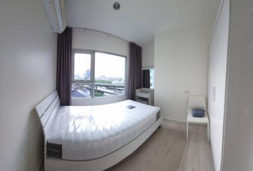 Modern bedroom with large windows and natural light