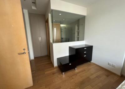 Bedroom with furniture and wooden flooring