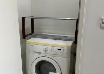 Compact laundry area with washing machine