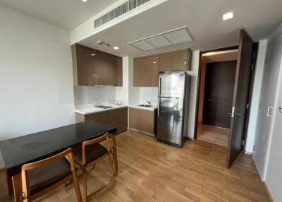 Modern kitchen with dining area and wooden flooring