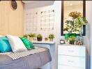 Bright and modern bedroom with bed, plants, and decorative elements