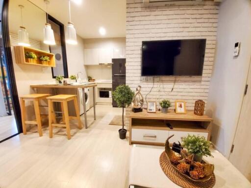 Modern living room and kitchen area with natural light