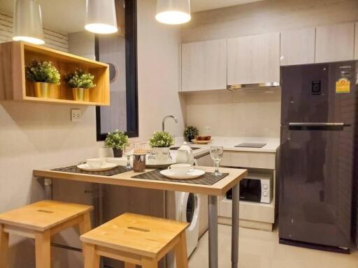 Modern kitchen with dining area and appliances