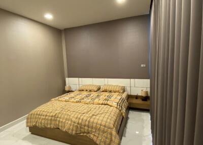 Modern bedroom with double bed and neutral decor