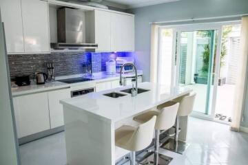 Modern kitchen with island and glass doors