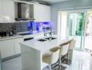 Modern kitchen with island and glass doors