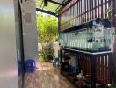 Covered patio with aquarium and seating area