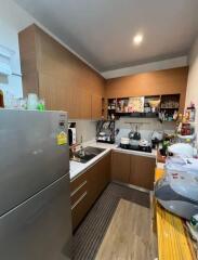 Modern kitchen with appliances and wooden cabinets