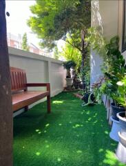 Green and lush balcony with seating area