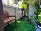 Green and lush balcony with seating area