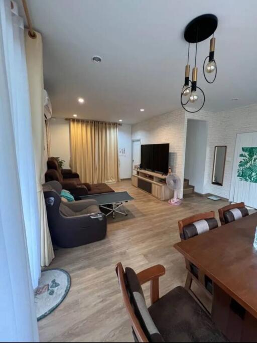 Spacious and modern living room with a dining area