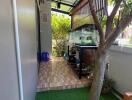 Covered outdoor area with fish tank and artificial grass