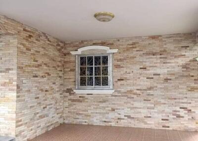 Covered outdoor area with tiled floor