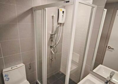 Modern bathroom with glass shower enclosure and contemporary fixtures