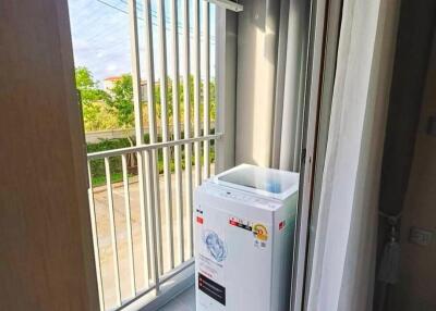 Balcony with washing machine and air conditioning unit