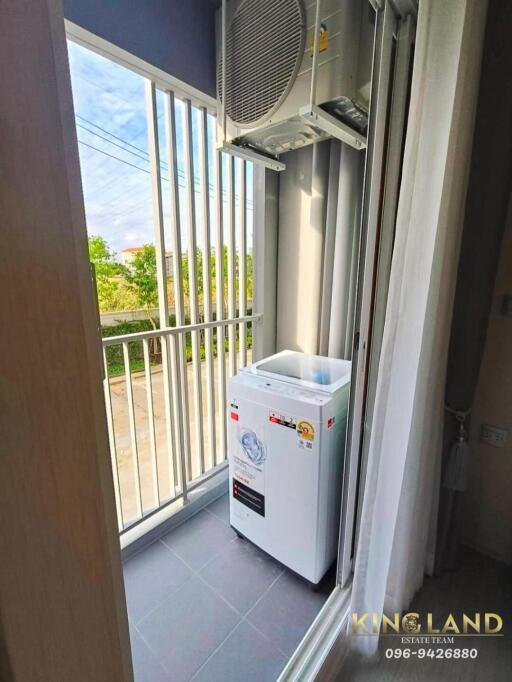 Balcony with washing machine and air conditioning unit