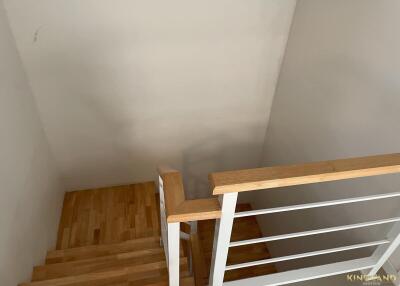 Wooden staircase with metal railing