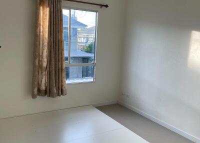 Bright bedroom with air conditioning and a large window