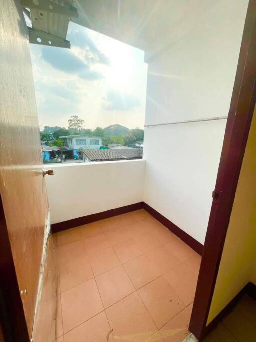 Small balcony with tiled floor and an open view