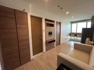 Modern living area with wooden floor and furniture