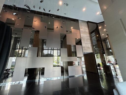 Modern building lobby with high ceiling and decorative elements