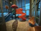 indoor children's playground with slide and seats