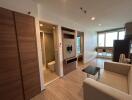 Modern living room with adjacent bathroom and kitchenette