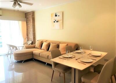 well-lit living room with dining area