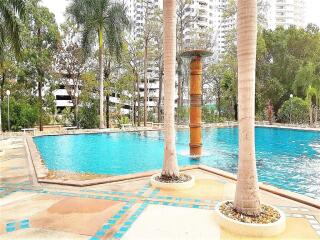 Outdoor swimming pool with surrounding modern buildings