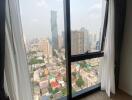 Bright living room with large windows and city view