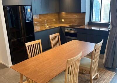 Modern kitchen with wooden dining table