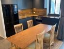 Modern kitchen with wooden dining table