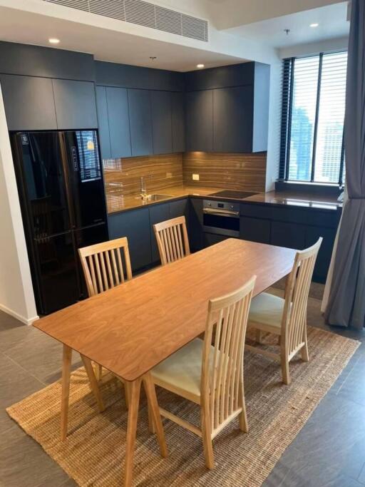 Modern kitchen with wooden dining table