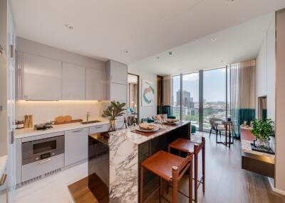 Modern open-plan kitchen connecting to a cozy living area with city views