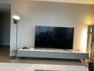 Modern living room with TV and lamp