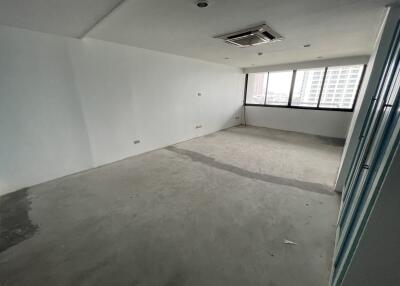 Empty room with large windows