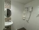 Modern bathroom with shower, sink, and tiled wall