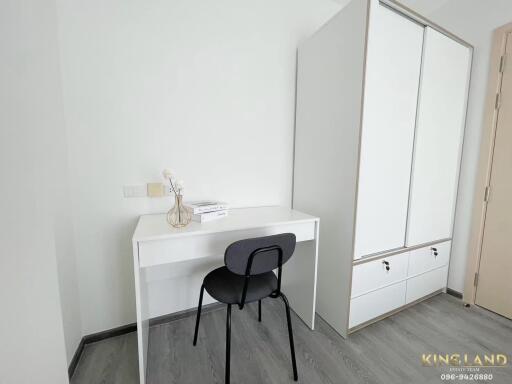 Simplistic bedroom corner with a study desk and wardrobe