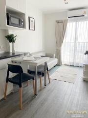 Living room with dining table and natural light