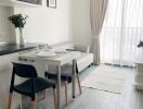 Living room with dining table and natural light