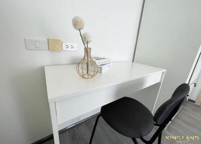 Minimalist study area with white desk