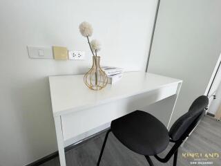 Minimalist study area with white desk